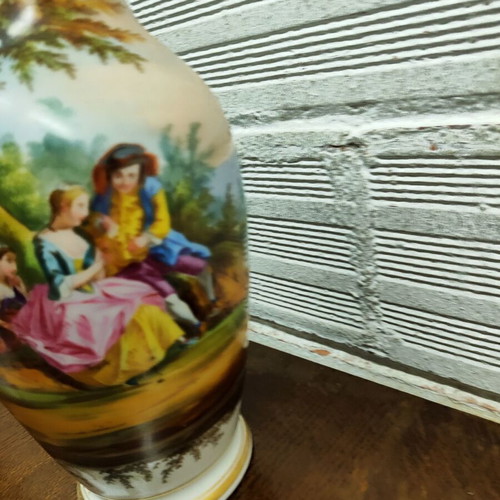 Old porcelain vase used, hand-painted with romantic scene