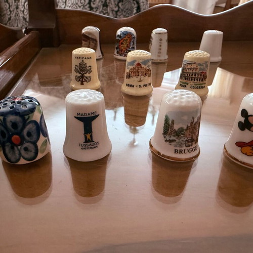 Collection of 12 collectible tourist thimbles