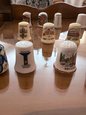 Collection of 12 collectible tourist thimbles
