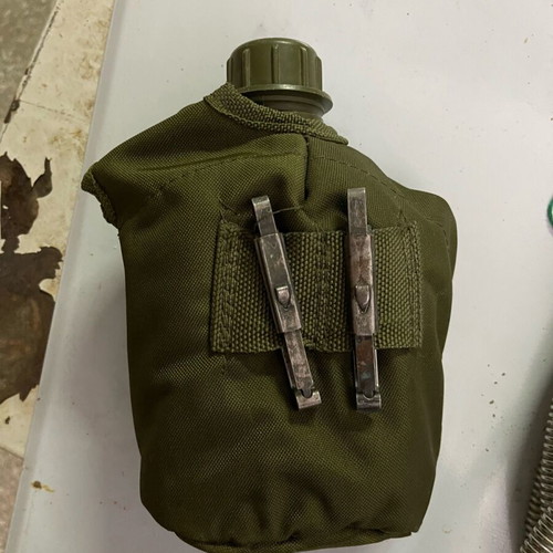 Military backpack M71 used with waterproof cover and ES canteen