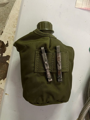 Military backpack M71 used with waterproof cover and ES canteen