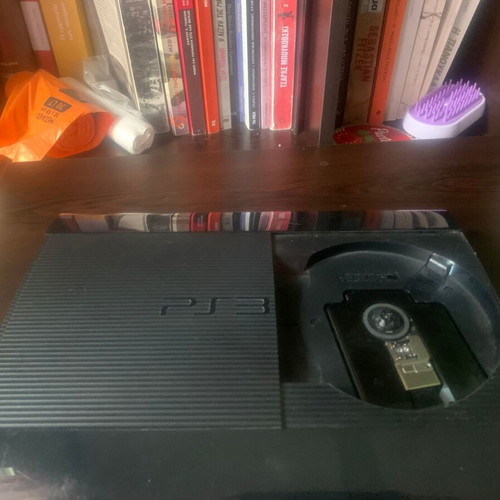 PlayStation 3 Super Slim 12 GB console like new with 4 games and controller