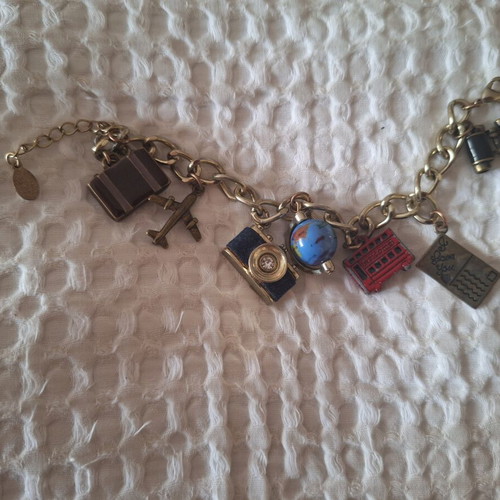 Travel-themed necklace new with globe and camera charms