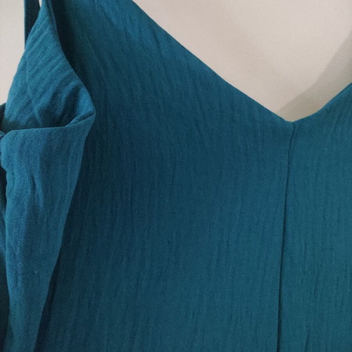 Jumpsuit like new with gold detail on straps, turquoise color