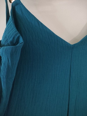 Jumpsuit like new with gold detail on straps, turquoise color