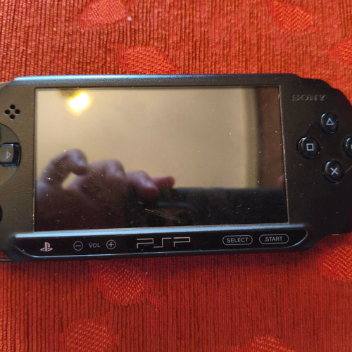 Sony PSP Street E1004 console with charger, case and 3 game cartridges