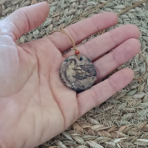 Ceramic handmade necklace like new with embossed dove and cord