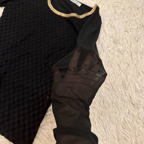 Black blouse used with gold metallic design and mesh sleeves