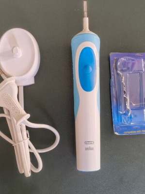 Oral-B Vitality electric rechargeable toothbrush with charger and replacement head