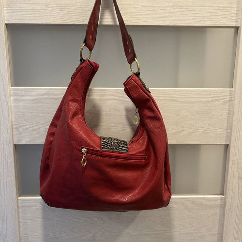 Red hobo shoulder bag like new with decorative details