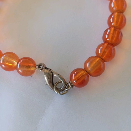 Orange bracelets set of 2 with boy and girl charms