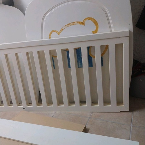 Baby cot used with accessories and fresh sheets