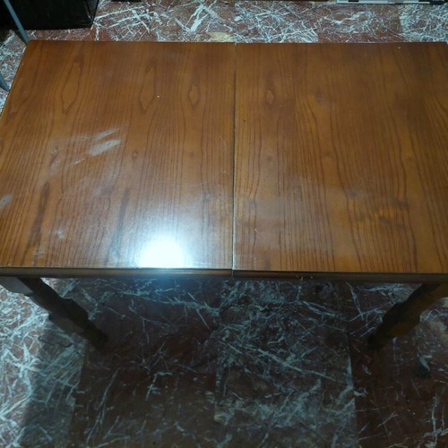 Wooden dining table with extension used