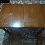 Wooden dining table with extension used