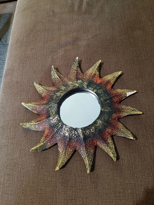 Decorative sun-shaped mirror used