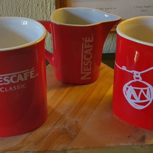 Collectible Nescafé cups and milk jug like new
