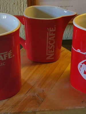 Collectible Nescafé cups and milk jug like new