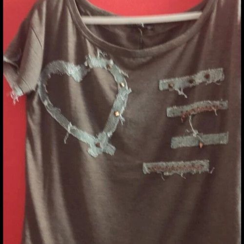 Top khaki with frayed edges and studs like new, size medium/large