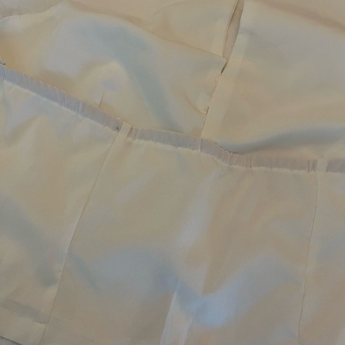 White sleeveless top with bows size S like new