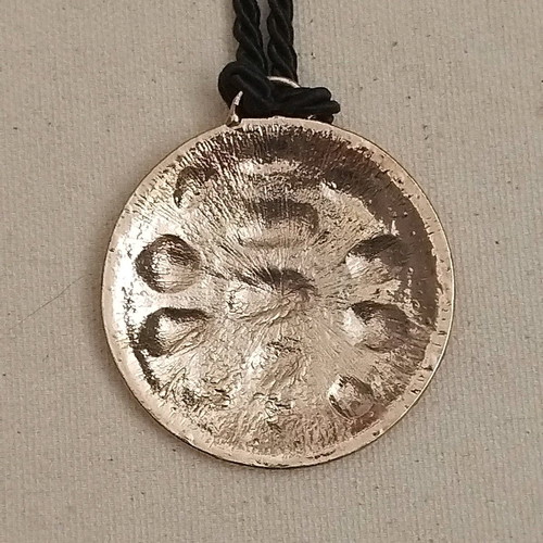Pendant like new with turtle design on black cord