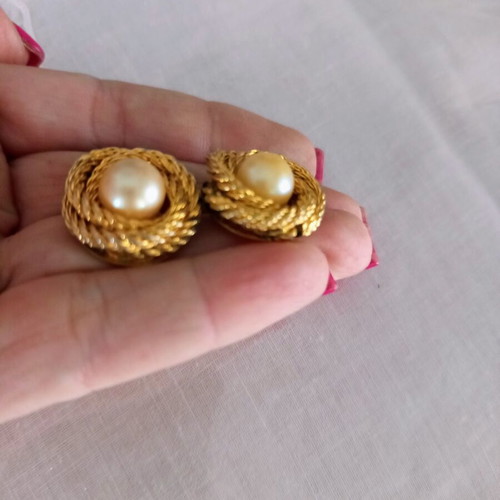 Vintage clip-on earrings used with gold embossed design and white pearl