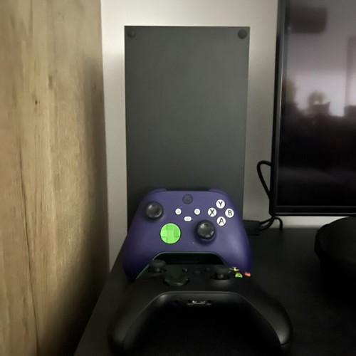 Xbox Series X 1TB console with two controllers and two games