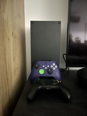 Xbox Series X 1TB console with two controllers and two games