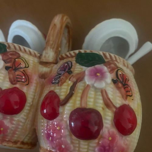 Ceramic jam pots used with spoons and decorative butterfly