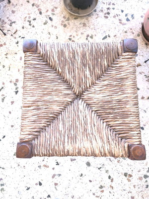 Vintage wicker stool used with wooden frame