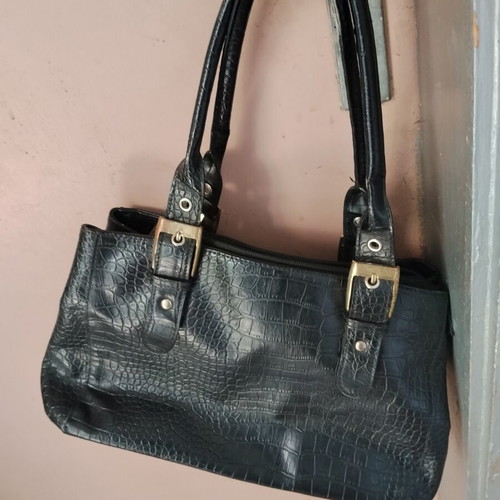 Vintage black women's shoulder bag with crocodile and snake texture, used