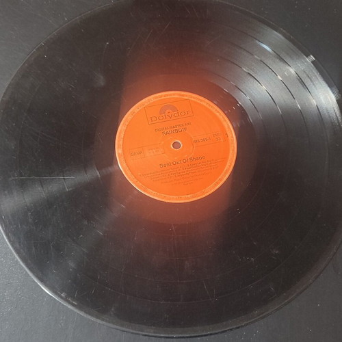 Bent Out Of Shape vinyl record used with scratches