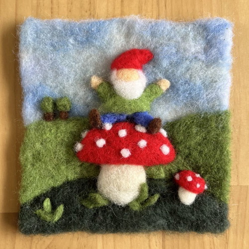Handmade wool wall art with gnome on mushroom