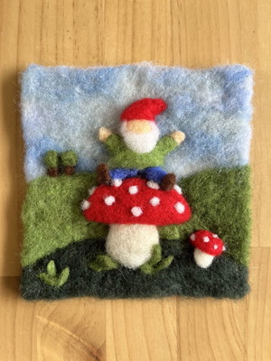 Handmade wool wall art with gnome on mushroom
