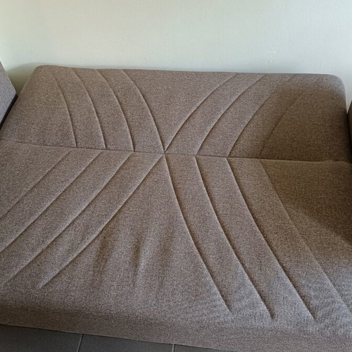 Two-seater sofa bed with storage space
