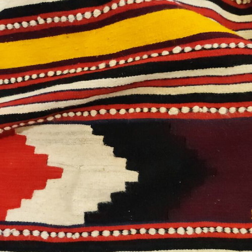 Woven rug used with geometric motifs and fringes