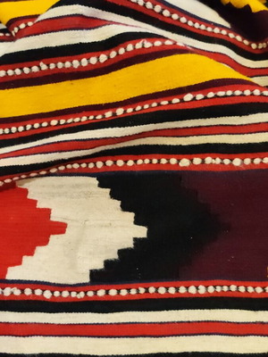 Woven rug used with geometric motifs and fringes