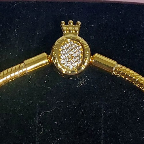 Pandora bracelet size 20 cm, gold plated with crown clasp