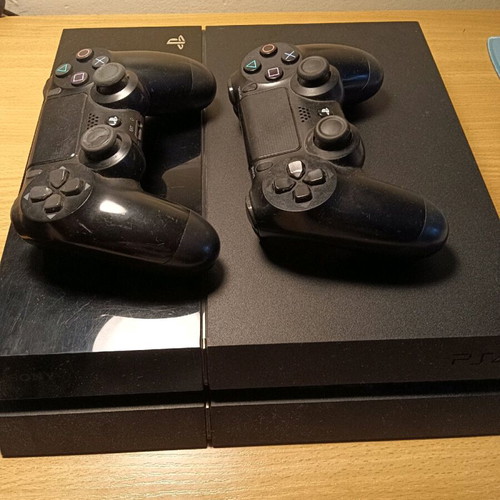 PlayStation 4 (PS4) like new with 2 controllers and HDMI cables