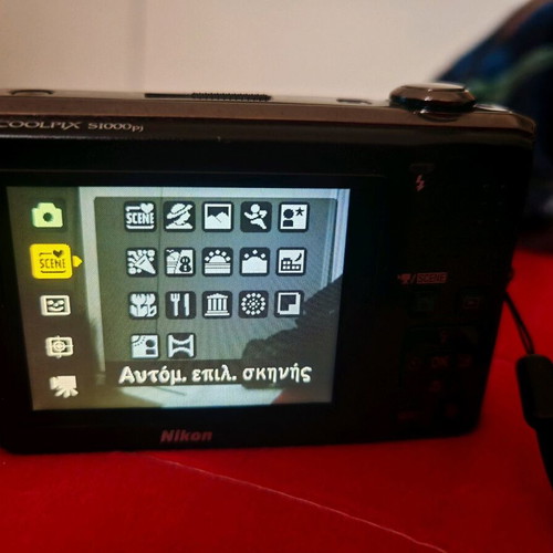 Nikon Coolpix S1000pj digital camera 12MP used with built-in projector