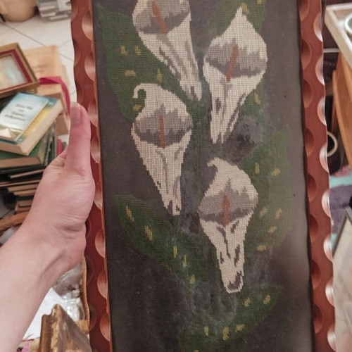Vintage embroidery lilies in frame used with protective glass