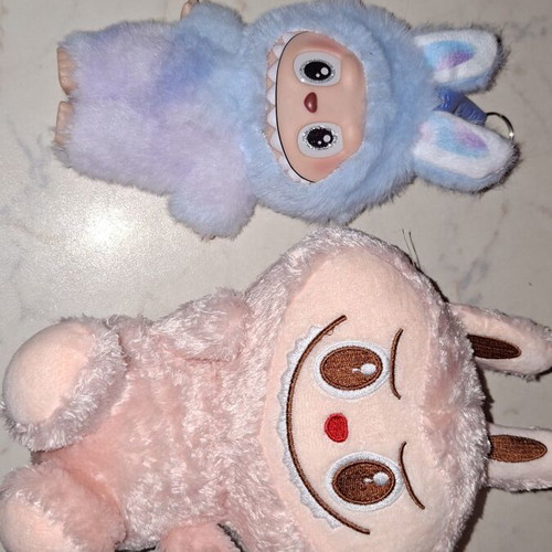 Labubu plush and plastic dolls like new