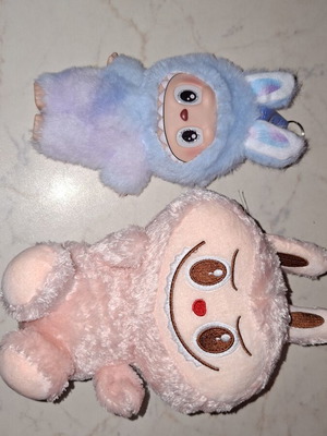 Labubu plush and plastic dolls like new