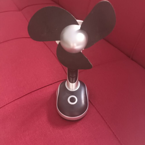 Portable fan used with base and rotating head, AA battery powered