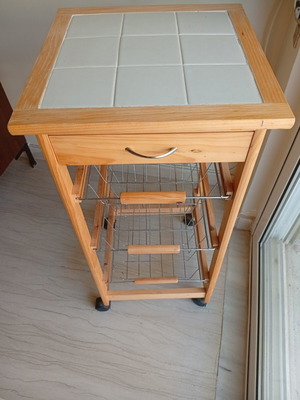 Classic wooden kitchen trolley with ceramic tile top