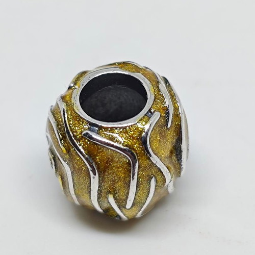 Silver charm bead with gold glitter enamel spiral design like new