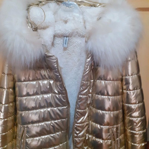 Short gold jacket with white fur and hood