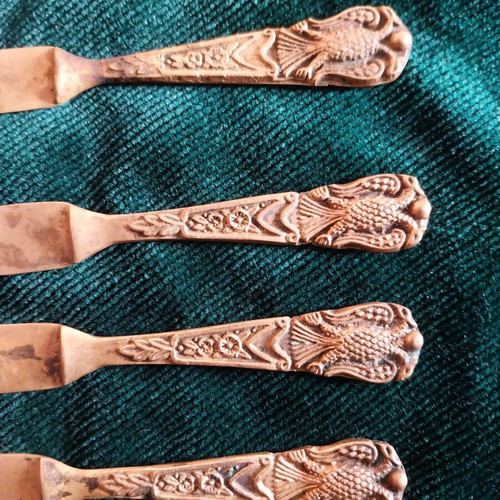 Set of used bronze knives and opener