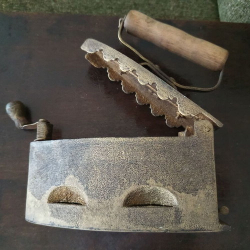 Decorative old charcoal iron refurbished with gold varnish