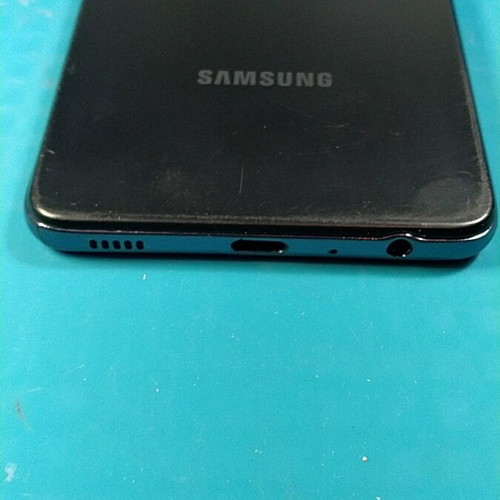 Samsung Galaxy A52s 5G smartphone used with cracked screen, Android 14
