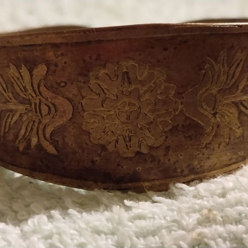Vintage copper cuff bracelet with Greek neoclassical motifs, used